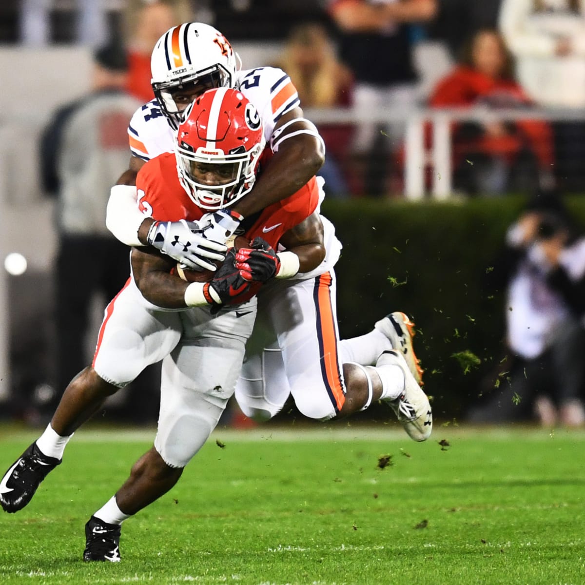 Photographer Tackles Fan Who Ran on Field During College Football Game