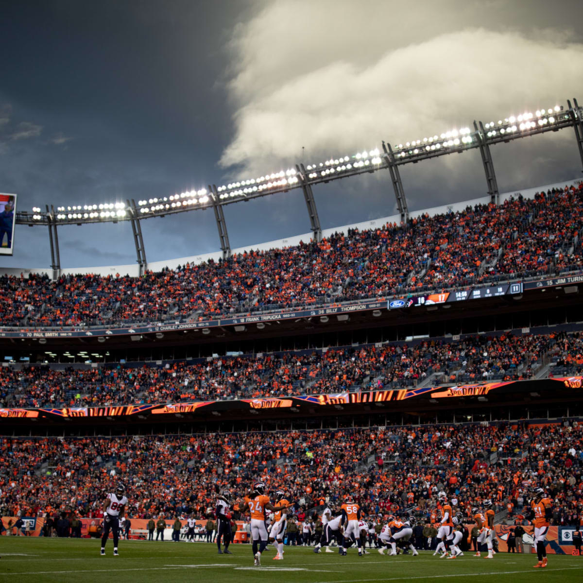 Denver Broncos stadium Empower Field at Mile High on fire as dark clouds of  smoke billow from building