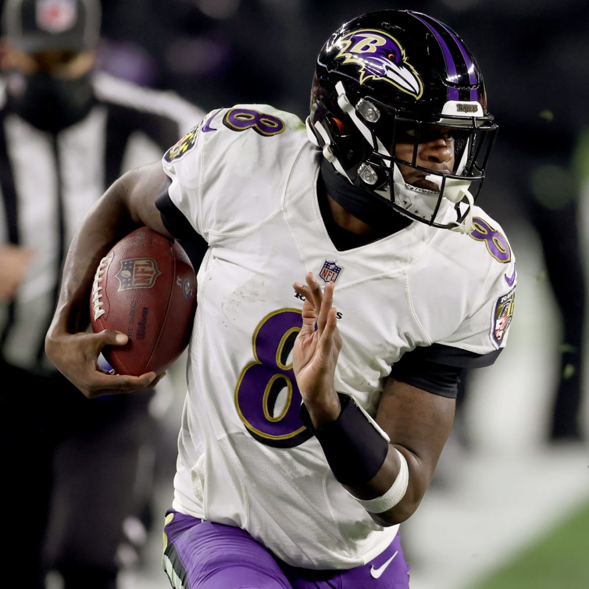 Quarterback Lamar Jackson of the Baltimore Ravens rushes against the