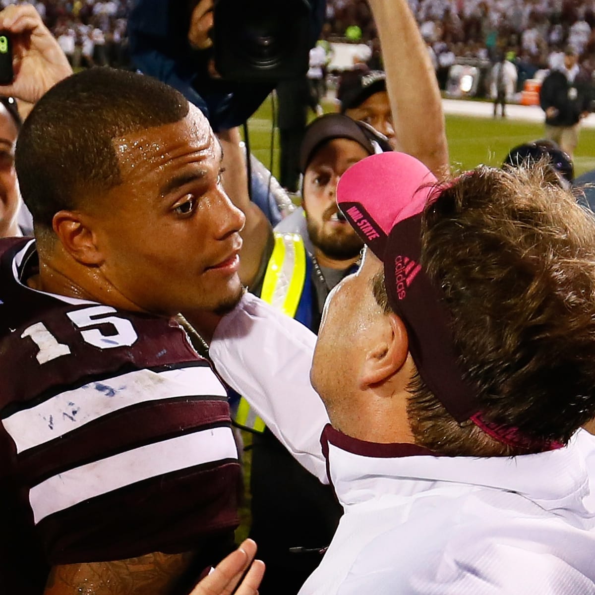 Dak Prescott Mississippi State Bulldogs Unsigned Maroon Jersey Touchdown Celebration During Liberty Bowl Photograph