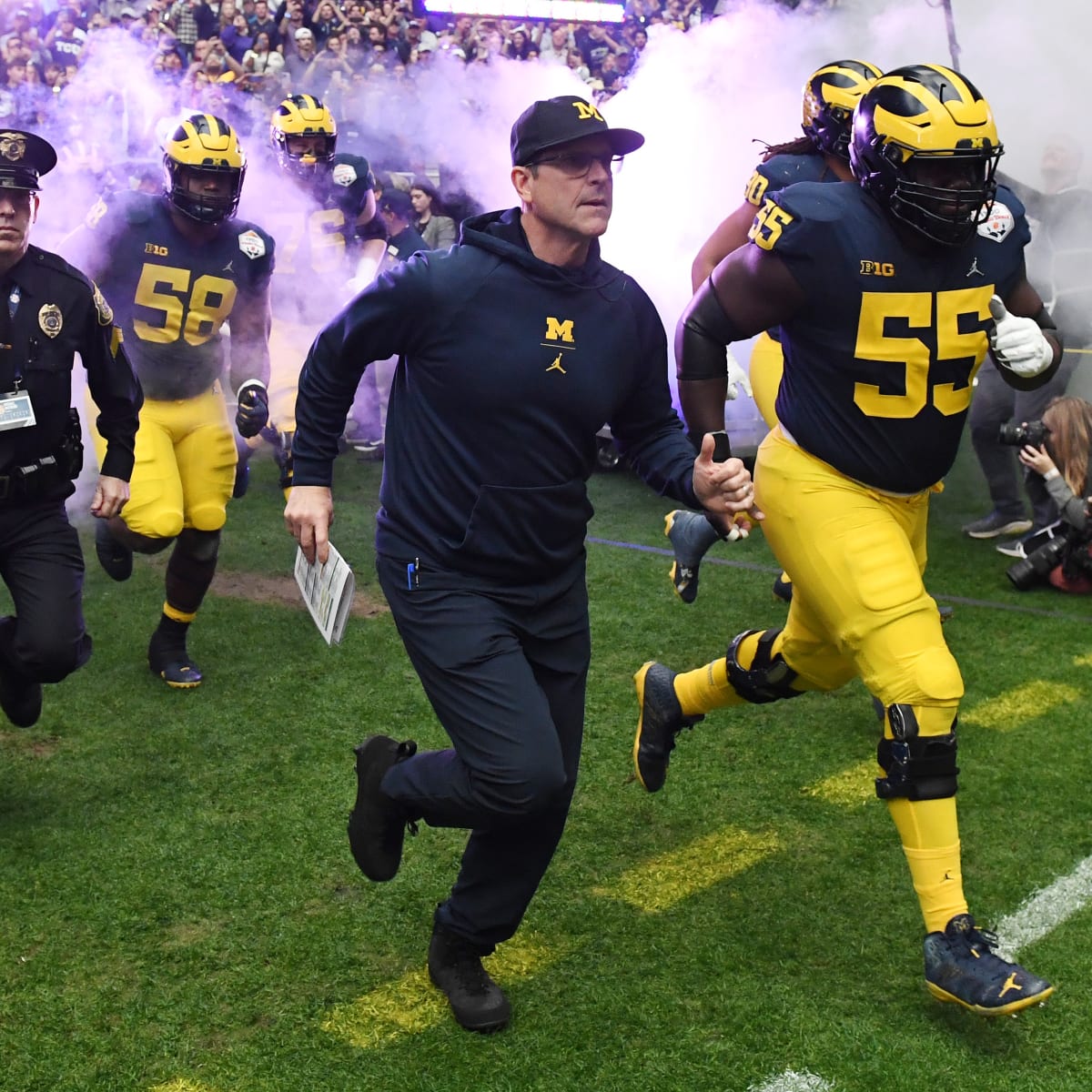 Jim Harbaugh calls Michigan president to say he's staying