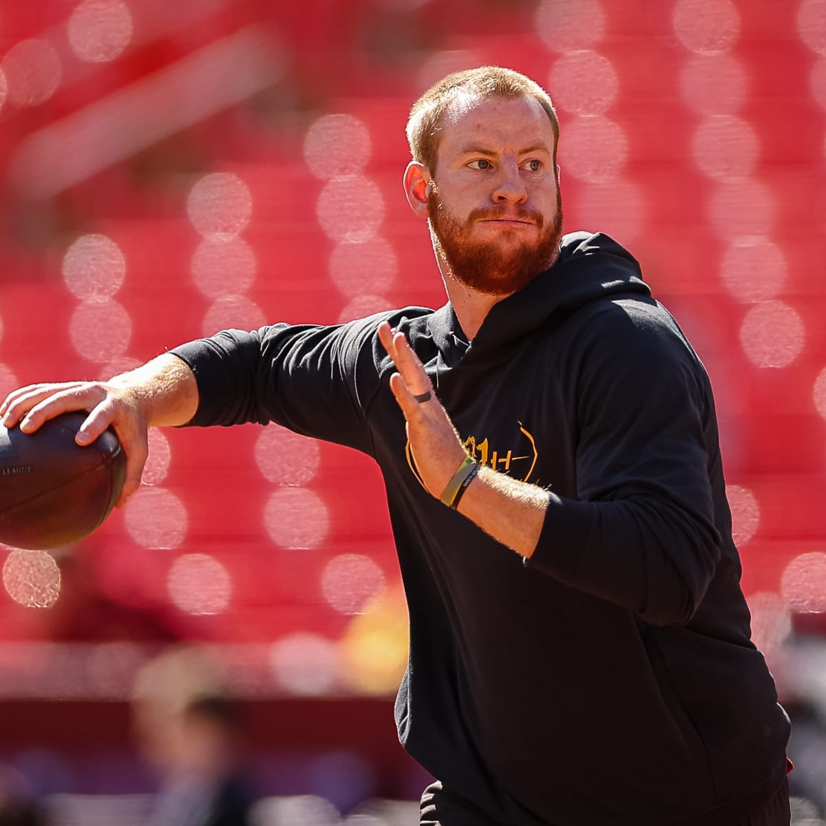 Carson Wentz wears gear from all 3 former teams during recent workout
