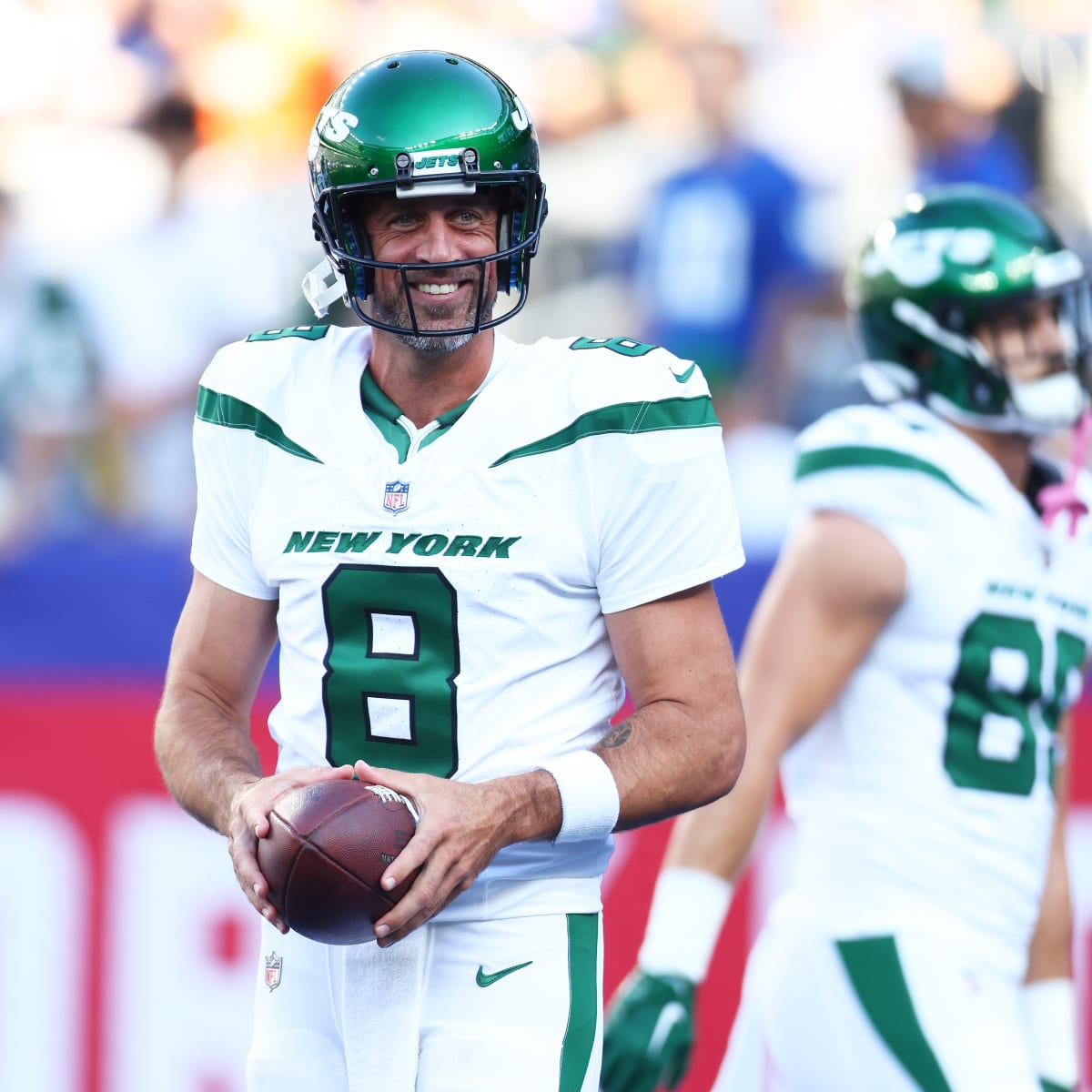 New York Jets quarterback Aaron Rodgers (8) calls out a play to his  teammates during the first half of an NFL preseason football game against  the New York Giants, Saturday, Aug. 26