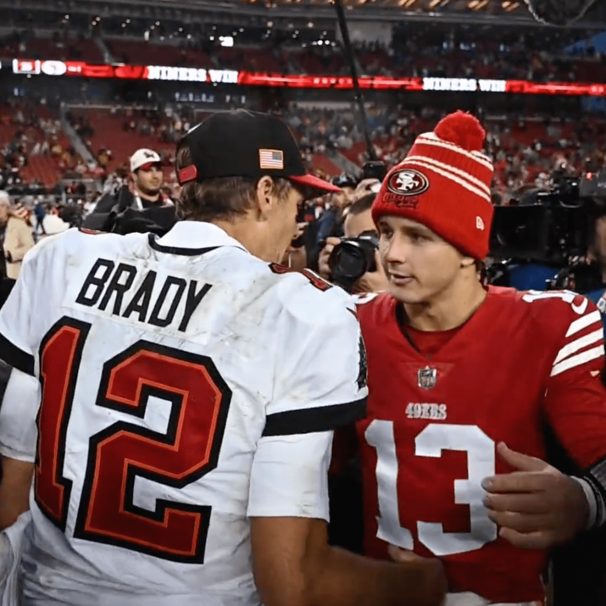 49ers' Dre Greenlaw gets Tom Brady to autograph ball after