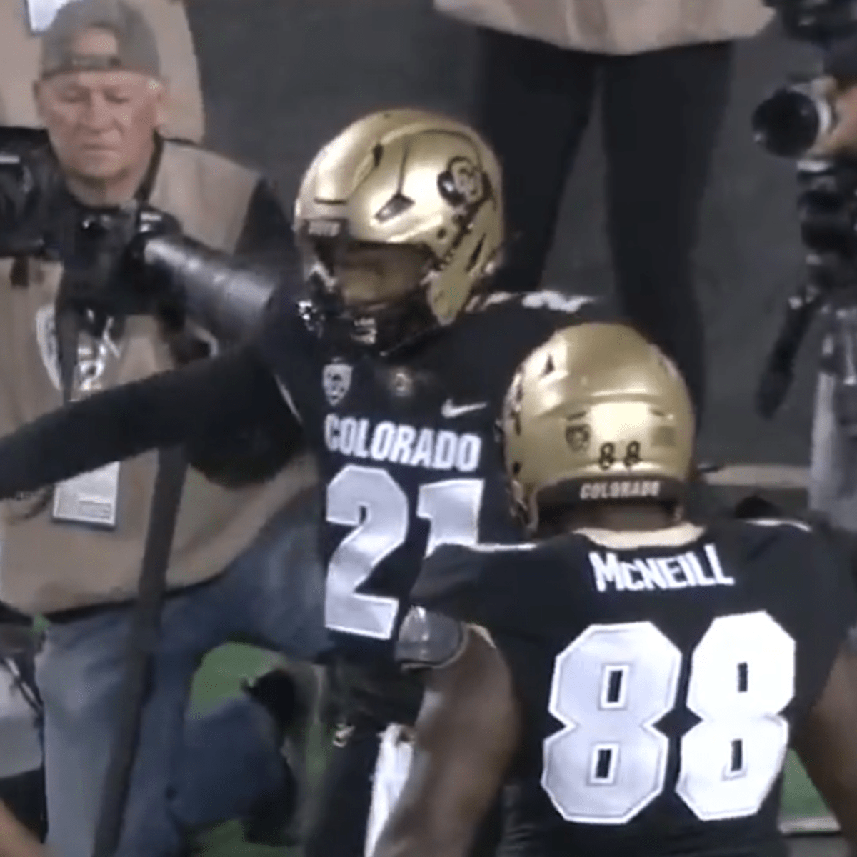 Deion Sanders and Son Shilo Share Warm Embrace Before Colorado Debut