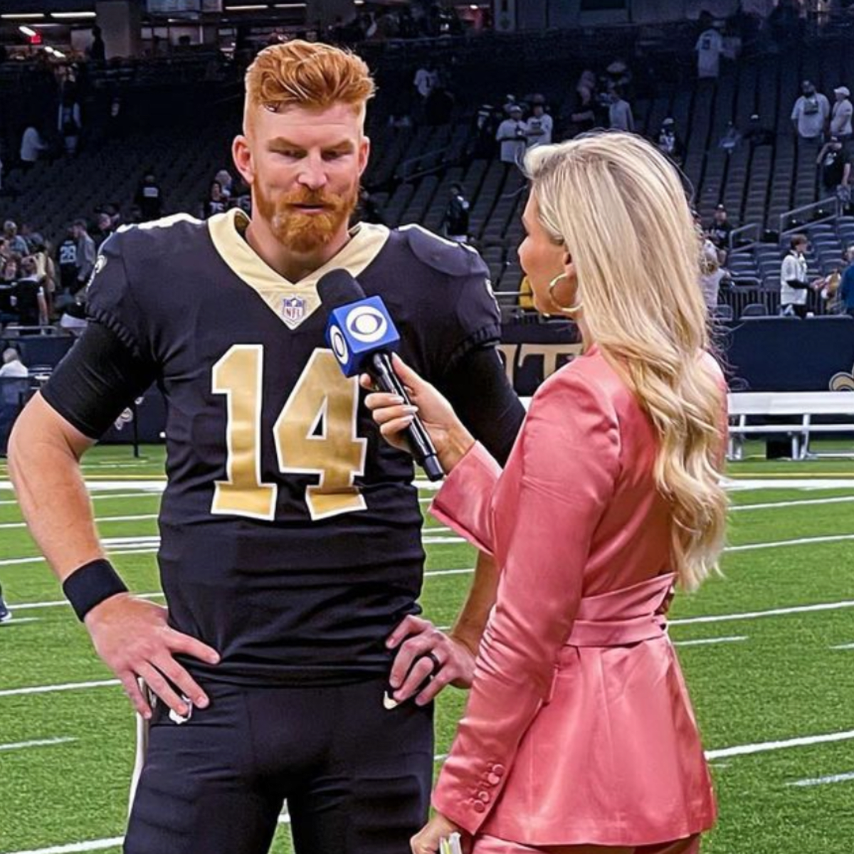 CBS Sports reporter Melanie Collins interviews Miami Dolphins