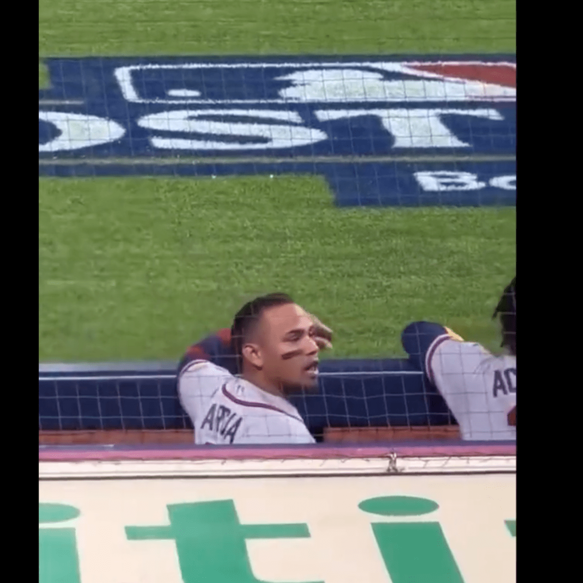 Orlando Arcia of the Atlanta Braves laughs during the Gatorade