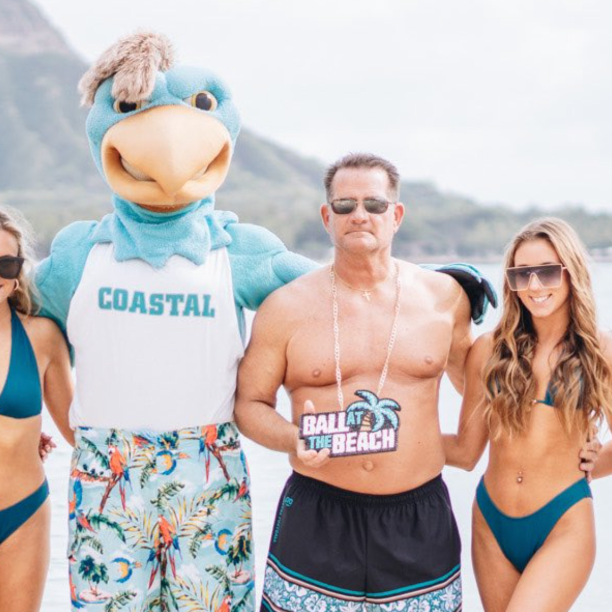 College Football Coach Posed For Swimsuit Photo With Team s