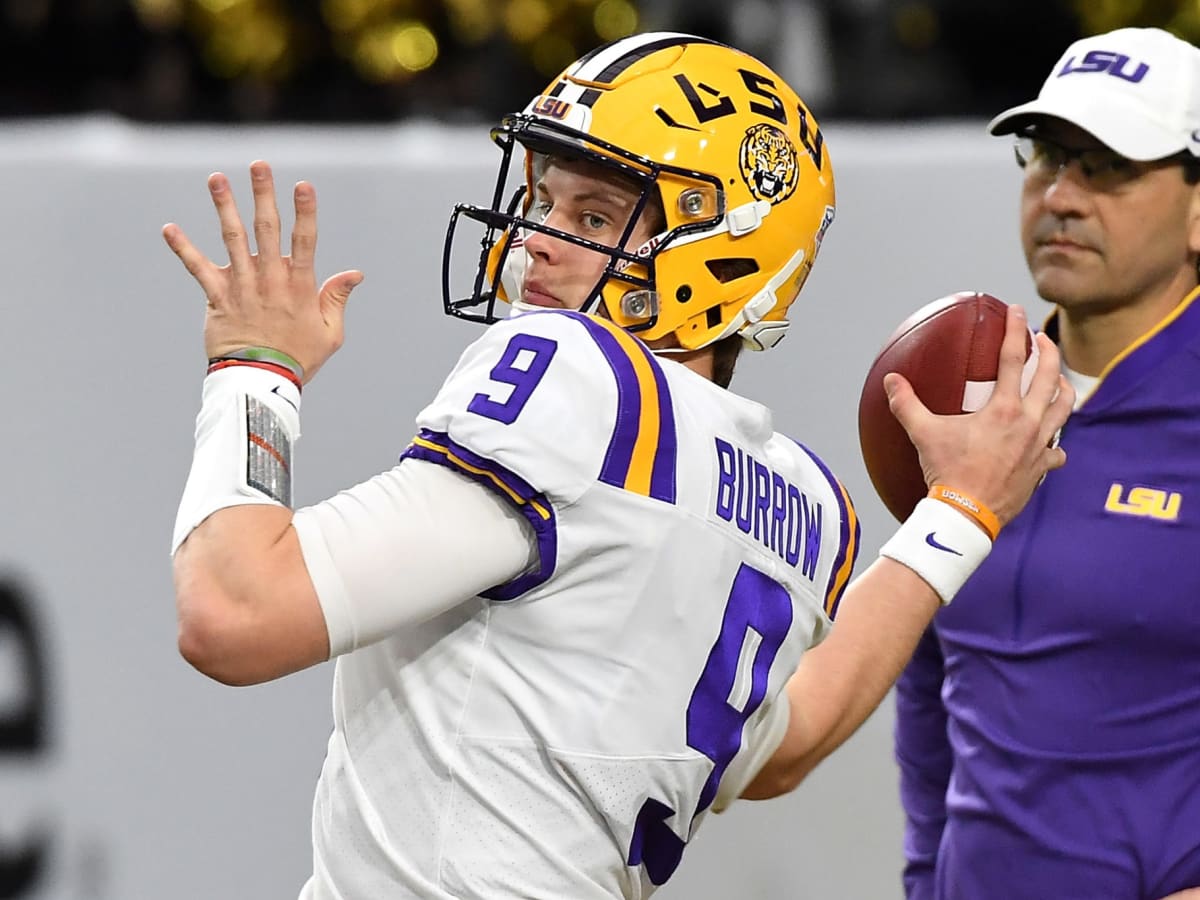 FILE - In this Jan. 1, 2019, file photo, LSU quarterback Joe Burrow attends  warmups before the Fiesta Bowl NCAA college football game against UCF in  Glendale, Ariz. This year, a group