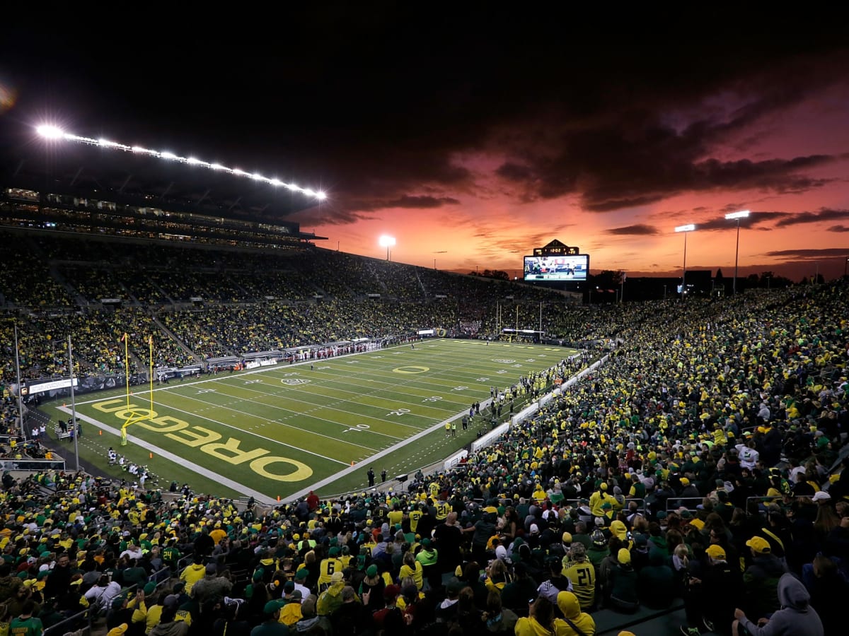 EUGENE, OR - OCTOBER 05: An Oregon Ducks cheerleader watches a video replay  during a college football game between the Cal Bears and Oregon Ducks at  Autzen Stadium in Eugene, Oregon. (Photo