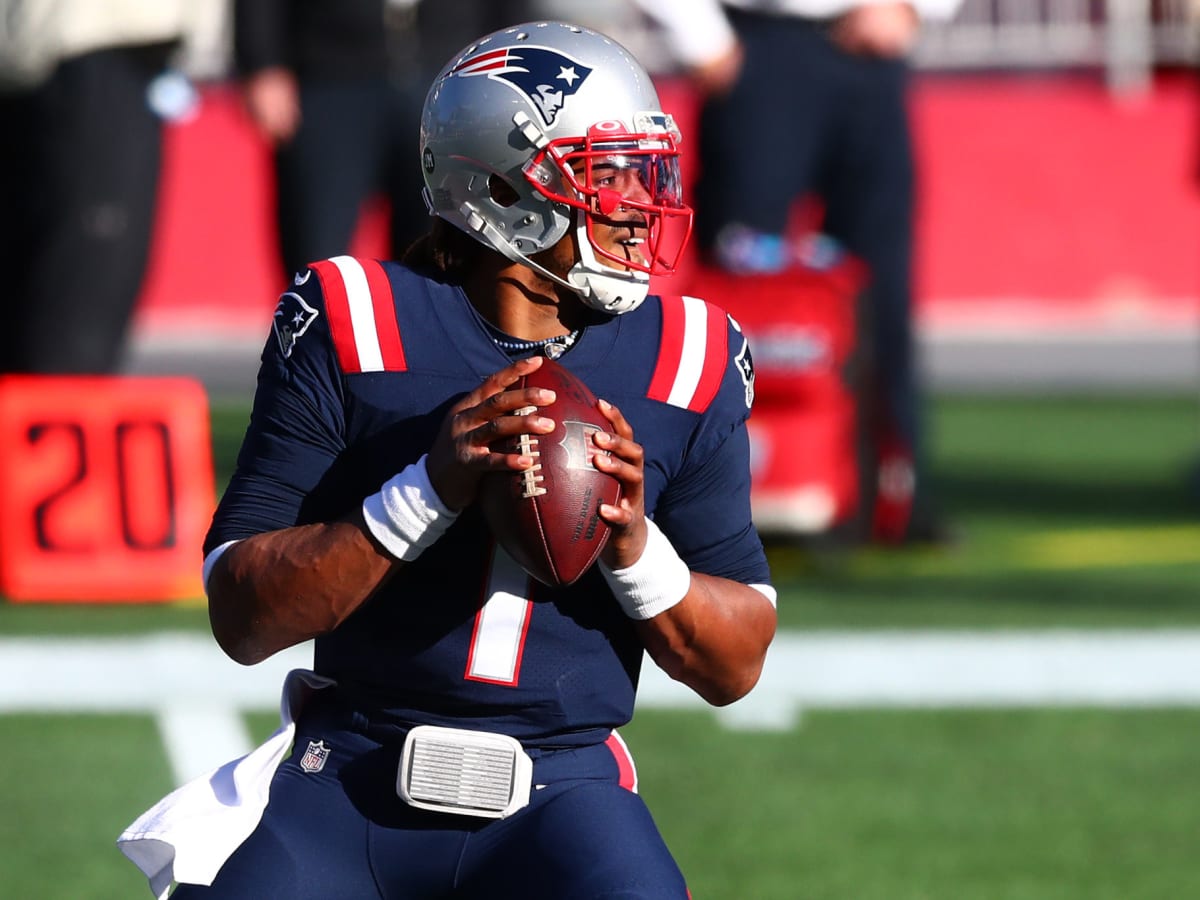 Cam Newton of the New England Patriots looks to throw the ball in