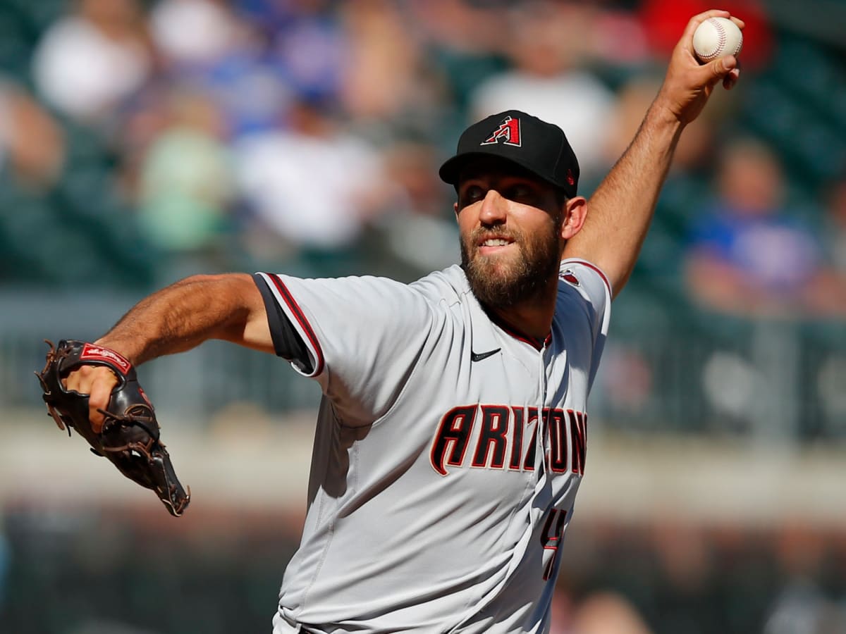 Arizona's Madison Bumgarner held back by teammates after first-inning  ejection, Arizona Diamondbacks