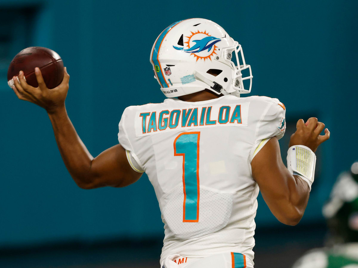 Miami Dolphins quarterback Jacoby Brissett (14) walks the