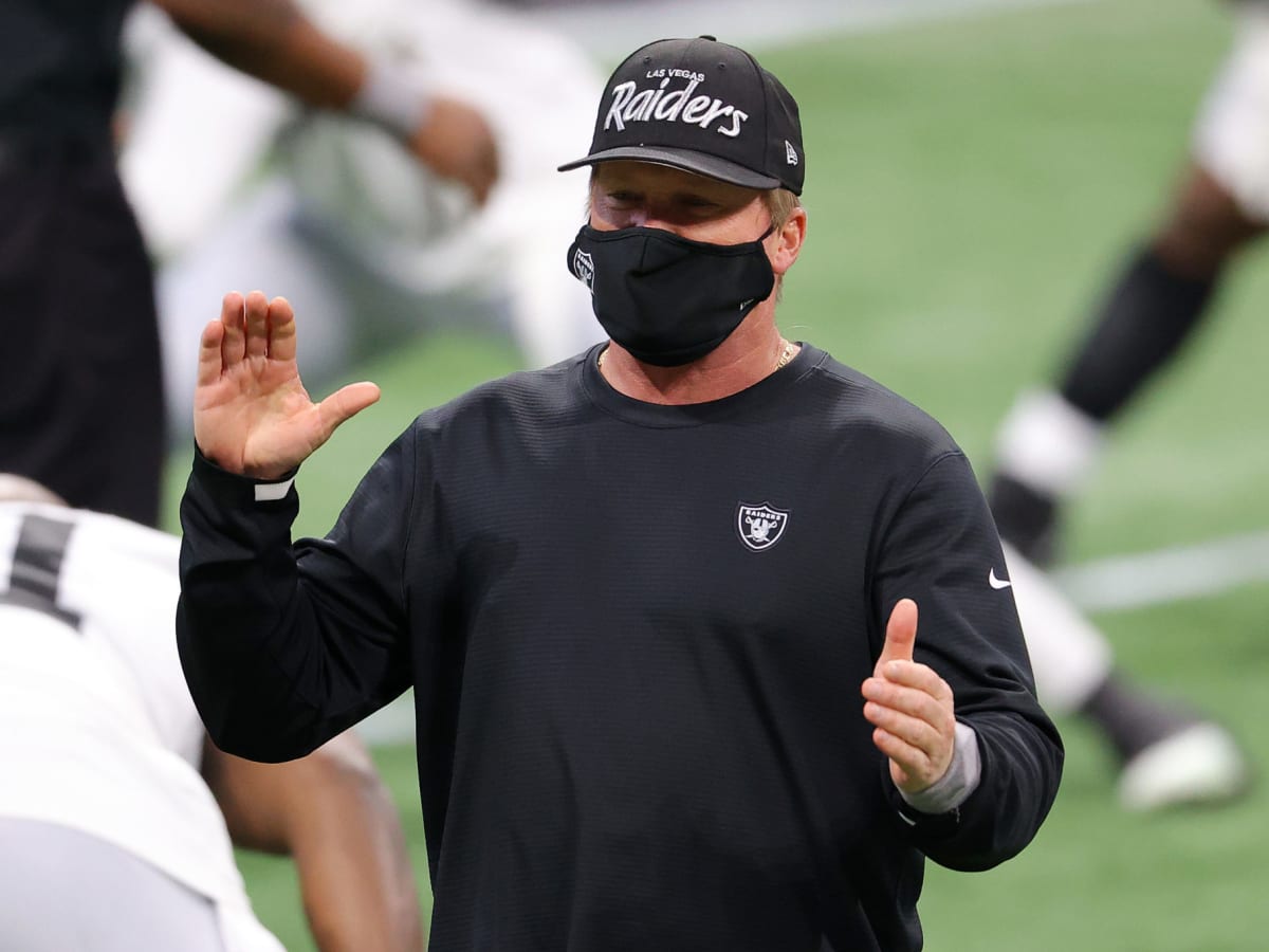 Las Vegas Raiders head coach Jon Gruden greets defensive end Carl