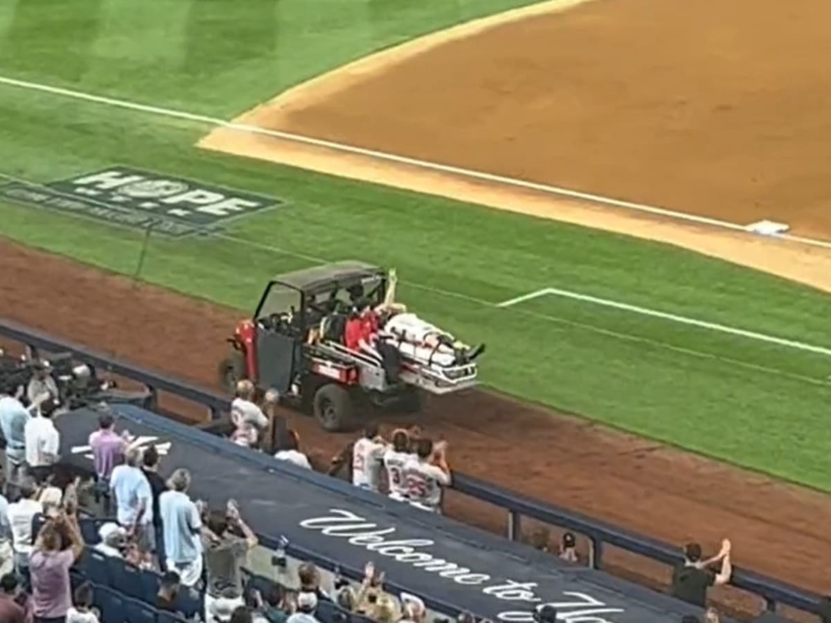 Cameraman stretchered off field after errant throw hits him in head at  Yankees game