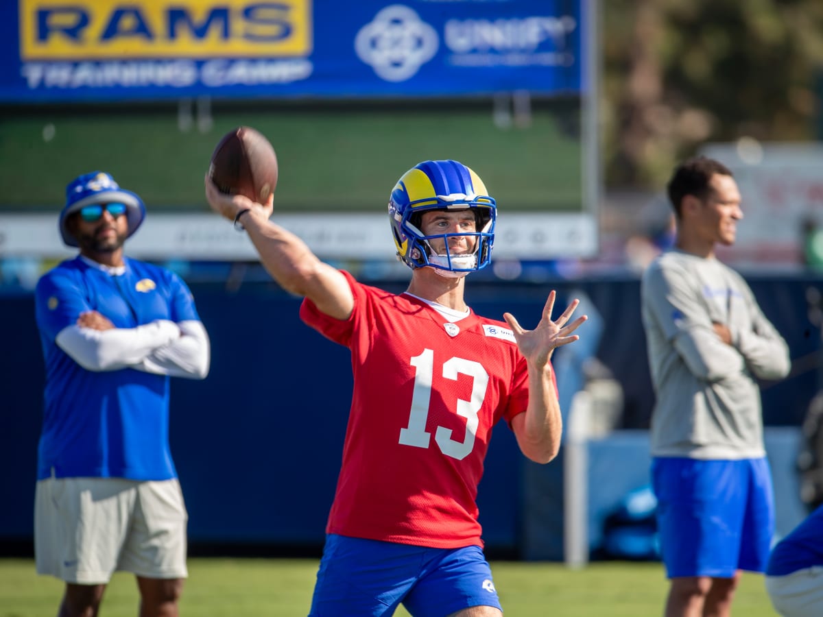 Quarterback Stetson Bennett of the Los Angeles Rams hands the ball News  Photo - Getty Images