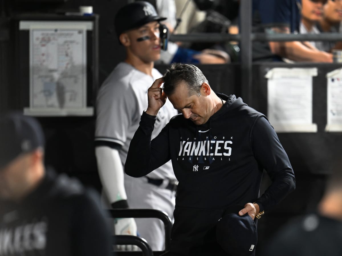 New York Yankees manager Aaron Boone (17) walks off the field