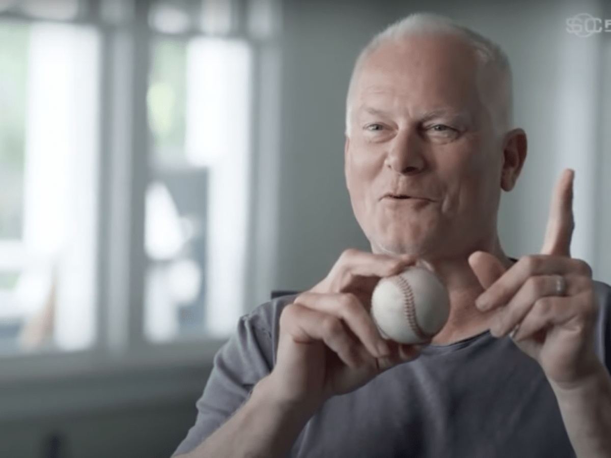 Kenny Mayne of ESPN walks off the field after he hit himself in