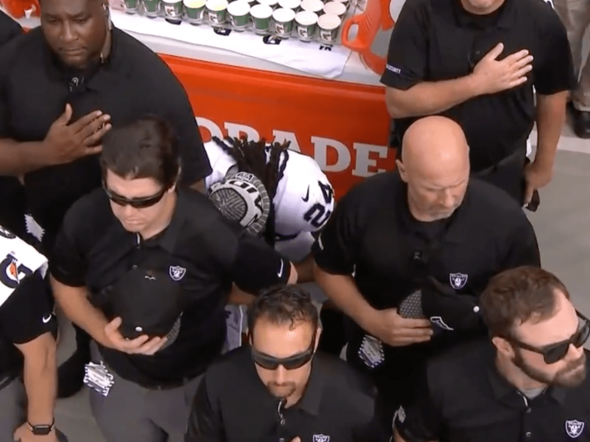 Raiders' Lynch wears 'Everybody vs. Trump' shirt, hidden by staff