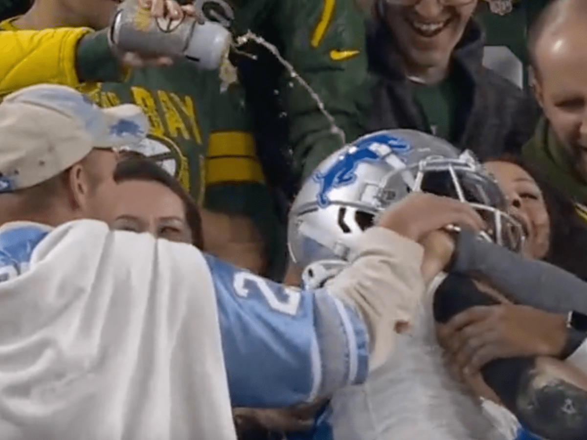 A Packers fan poured beer on Detroit Lions WR Amon-Ra St. Brown