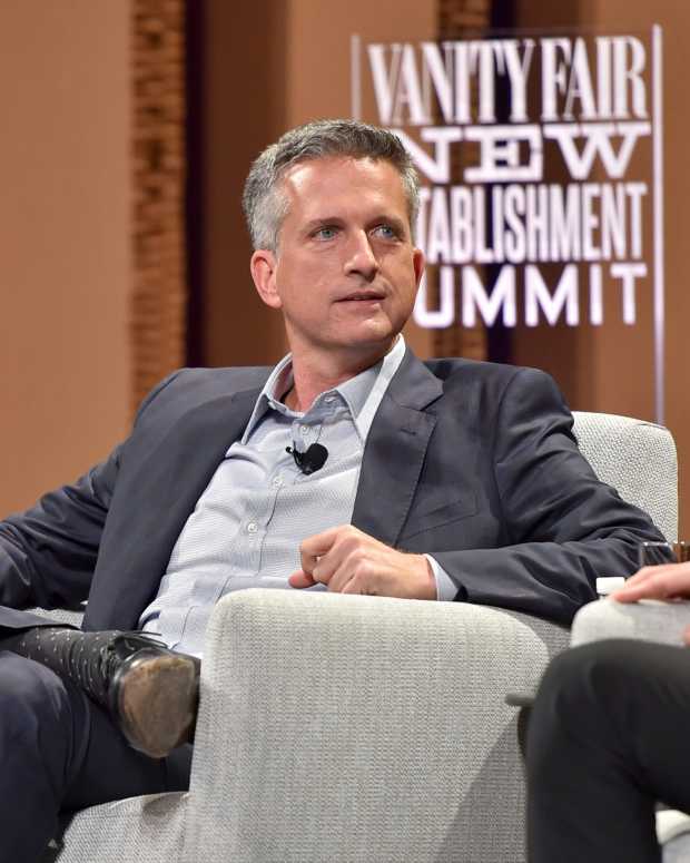 Bill Simmons sitting on stage at an event.