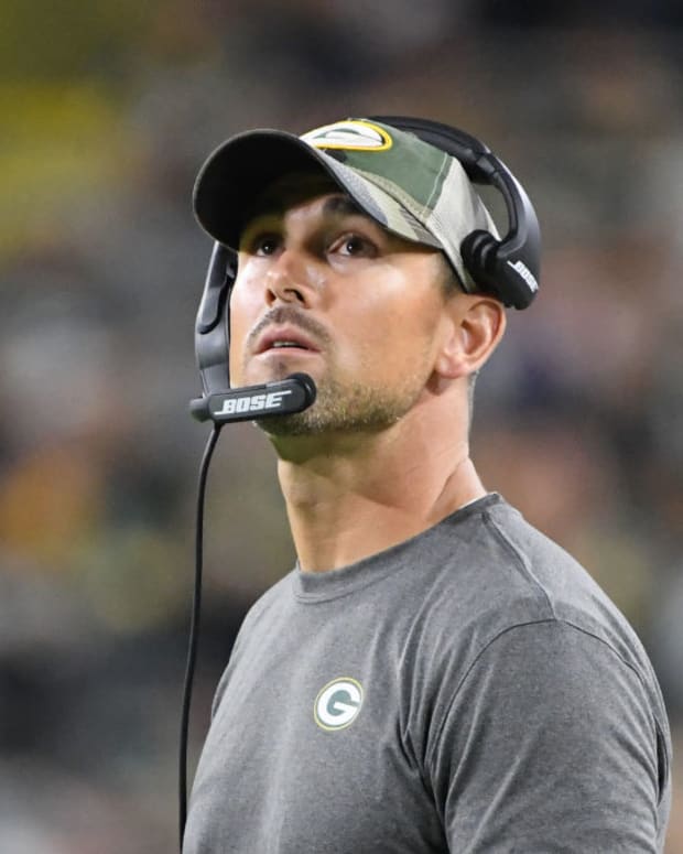 Matt LaFleur looks up from the sidelines in a Packers preseason game.