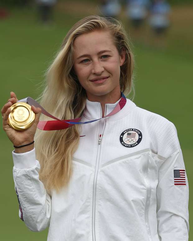 Nelly Korda poses with the gold medal.