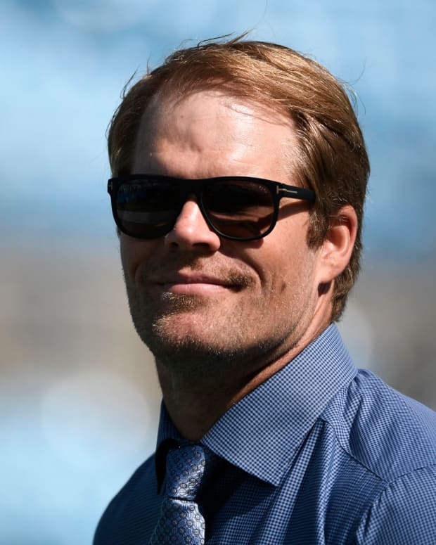 A closeup head shot of Greg Olsen on the field before a game.