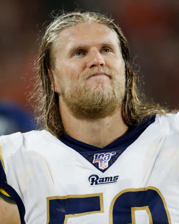 Clay Matthews stands on the sideline.