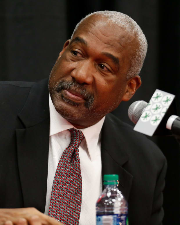 Ohio State football athletic director Gene Smith at a press conference about college football coach Urban Meyer.
