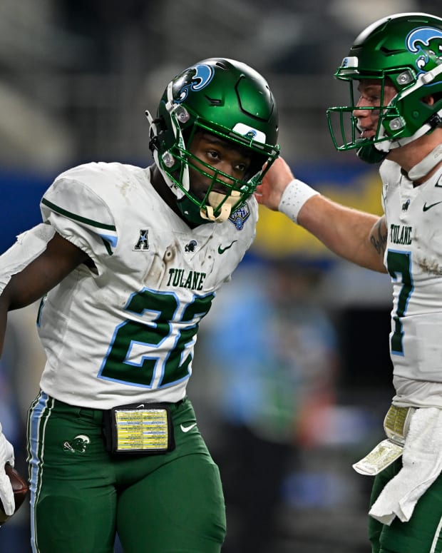 Tulane running back Tyjae Spears and quarterback Michael Pratt celebrate a touchdown against USC in the Cotton Bowl.