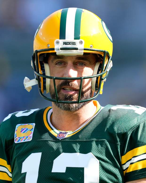 Packers quarterback Aaron Rodgers on the field against the Patriots.