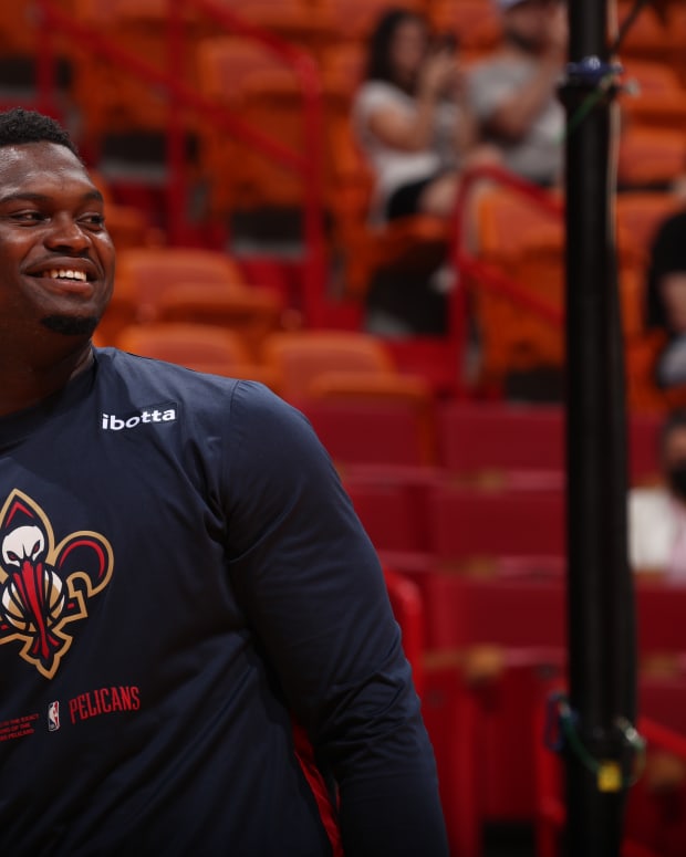 Pelicans big man Zion Williamson looks on the court during warmups.