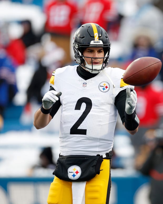 ORCHARD PARK, NEW YORK - JANUARY 15: Mason Rudolph #2 of the Pittsburgh Steelers warms up with Mason Cole #61 before the game against the Buffalo Bills at Highmark Stadium on January 15, 2024 in Orchard Park, New York. (Photo by Sarah Stier/Getty Images)