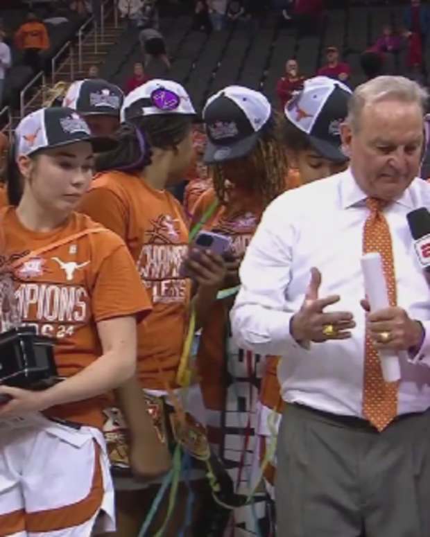 Texas head coach Vic Schaefer celebrates winning the Big 12 title.