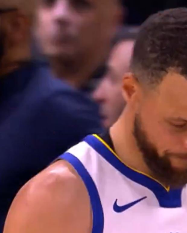 Stephen Curry shakes his head in disappointment after Draymond Green gets ejected.
