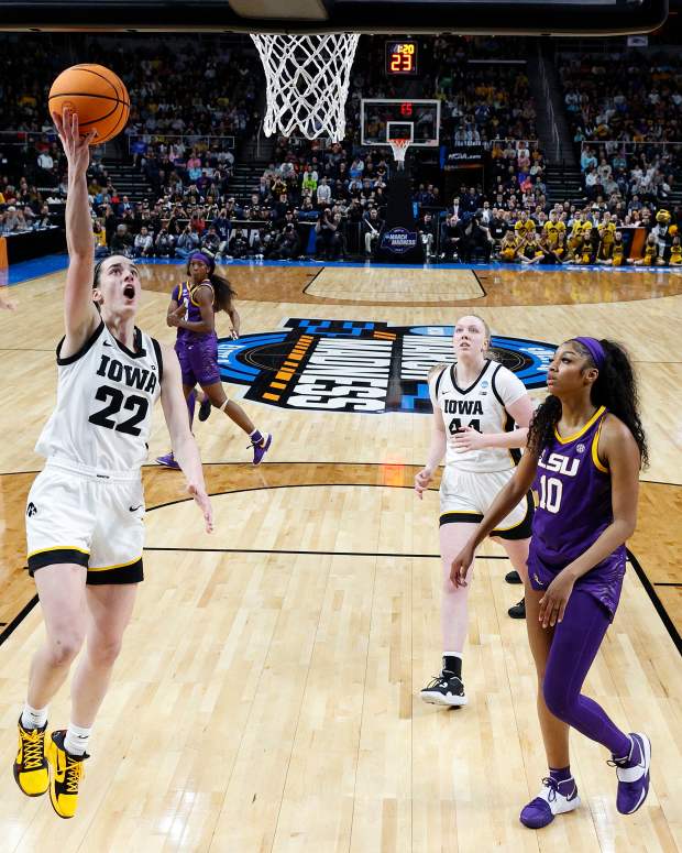 ALBANY, NEW YORK - APRIL 01: Caitlin Clark #22 of the Iowa Hawkeyes shoots the ball over Angel Reese #10 of the LSU Tigers during the first half in the Elite 8 round of the NCAA Women's Basketball Tournament at MVP Arena on April 01, 2024 in Albany, New York. (Photo by Sarah Stier/Getty Images)