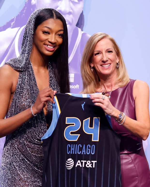 Angel Reese poses with WNBA commissioner Cathy Engelbert after being drafted.