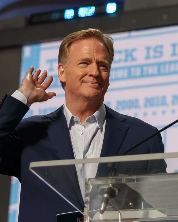KANSAS CITY, MO - APRIL 28: Commissioner Roger Goodell holds his hand to his ear as if to tell the crowd he can't hear the boos during day two of the NFL Draft on April 28, 2023 at Union Station in Kansas City, MO. (Photo by Scott Winters/Icon Sportswire via Getty Images)