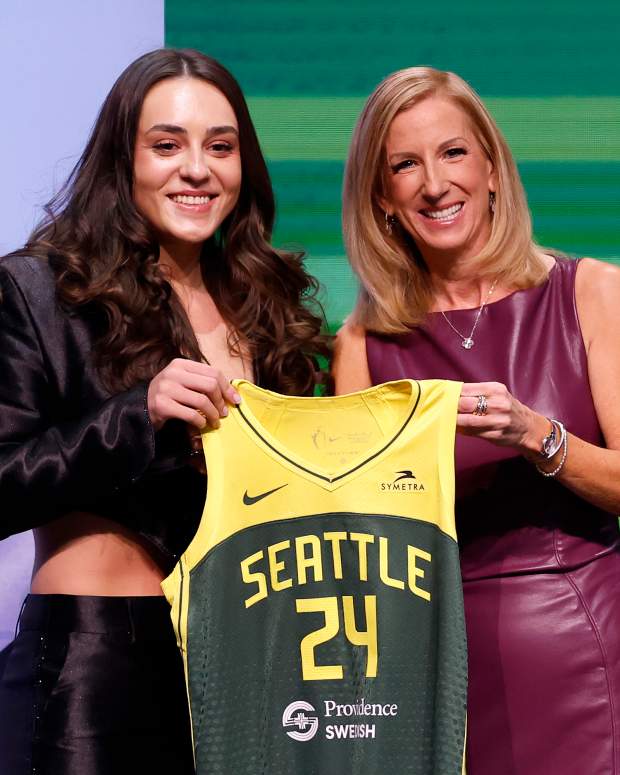 NEW YORK, NEW YORK - APRIL 15: Nika Muhl poses with WNBA Commissioner Cathy Engelbert after being selected 14th overall pick by the Seattle Storm during the 2024 WNBA Draft at Brooklyn Academy of Music on April 15, 2024 in New York City. (Photo by Sarah Stier/Getty Images)