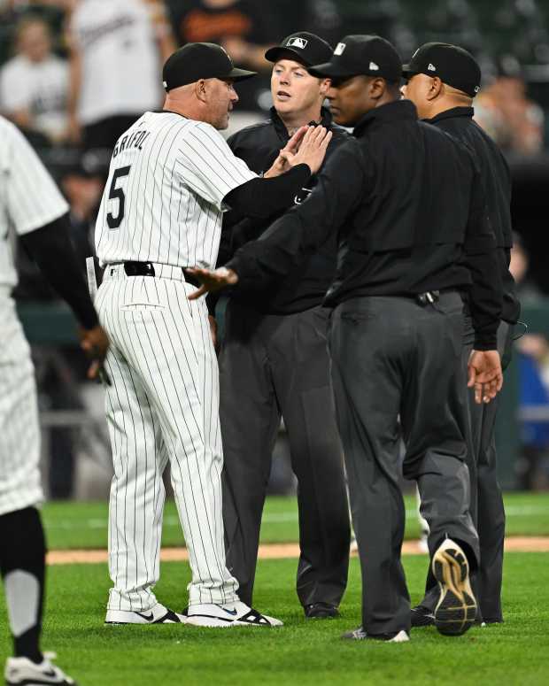 CHICAGO, IL - MAY 23: Manager Pedro Grifol #5 of the Chicago White Sox talks with umpires after baserunner Andrew Vaughn #25 was called out for interference ending the game against the Baltimore Orioles at Guaranteed Rate Field on May 23, 2024 in Chicago, Illinois. Baltimore defeated Chicago 8-6. (Photo by Jamie Sabau/Getty Images)