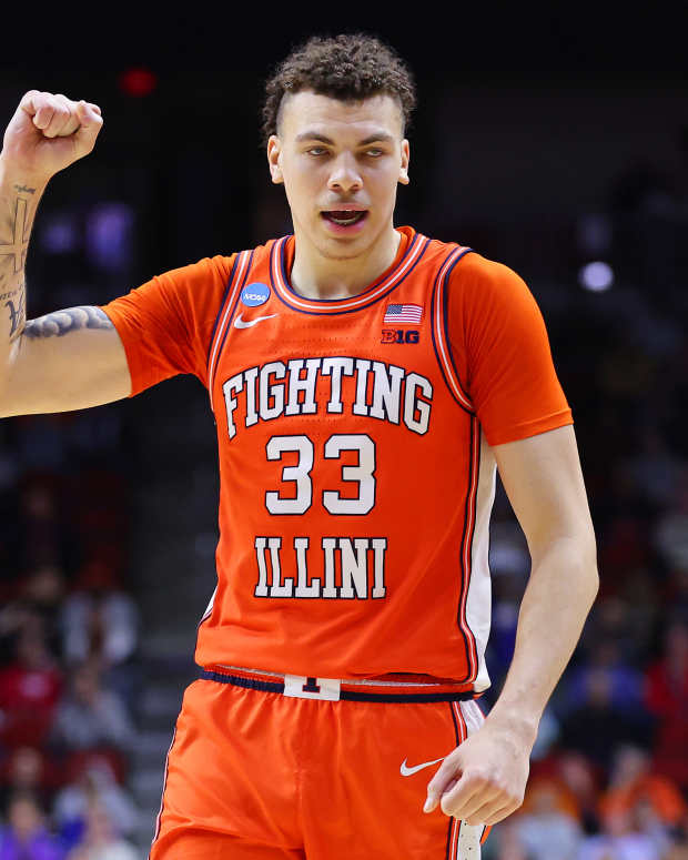 DES MOINES, IOWA - MARCH 16: Coleman Hawkins #33 of the Illinois Fighting Illini celebrates after scoring a basket against the Arkansas Razorbacks during the second half in the first round of the NCAA Men's Basketball Tournament at Wells Fargo Arena on March 16, 2023 in Des Moines, Iowa. (Photo by Michael Reaves/Getty Images)