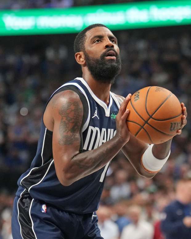 Mavericks guard Kyrie Irving shoots a free throw.