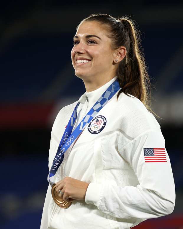 TOKYO, JAPAN - AUGUST 06: Alex Morgan of Team USA poses with her Bronze medal after the Gold Medal Match Women's Football match between Canada and Sweden at International Stadium Yokohama on August 06, 2021 in Yokohama, Kanagawa, Japan. (Photo by Naomi Baker/Getty Images)