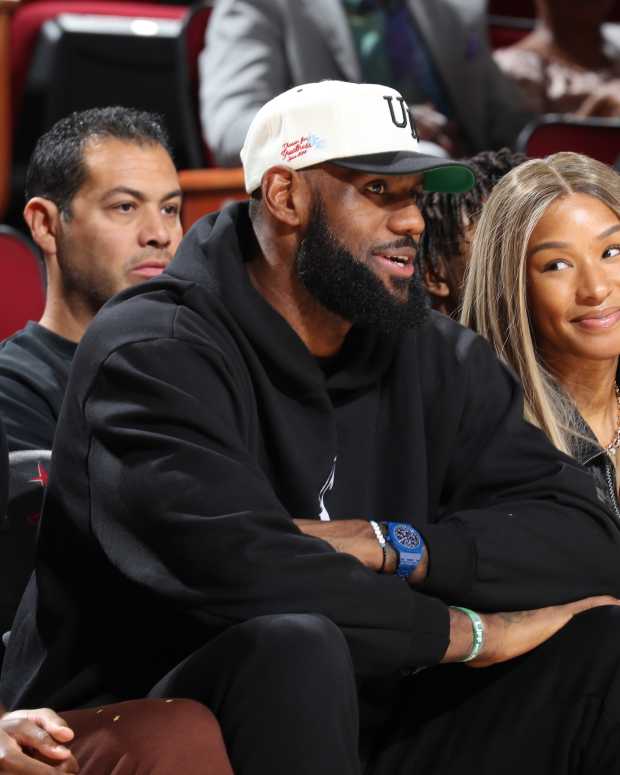 HOUSTON, TX - MARCH 28: From left to right  Bryce James and LeBron James and Savannah James are sitting in the front row to watch McDonalds High School All American Bronny James play during the 2023 McDonalds High School All American Boys Game at Toyota Center. (Photo by Brian Spurlock/Icon Sportswire via Getty Images