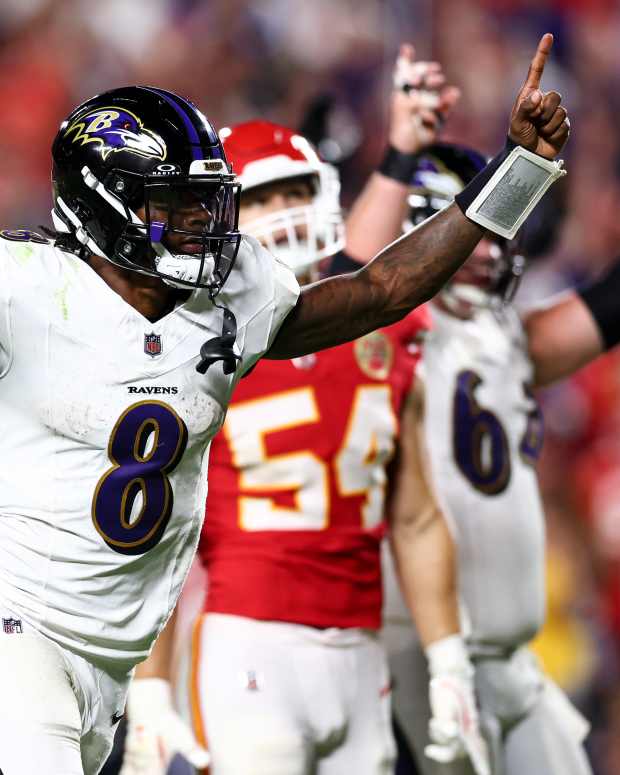 Lamar Jackson celebrates on the field.