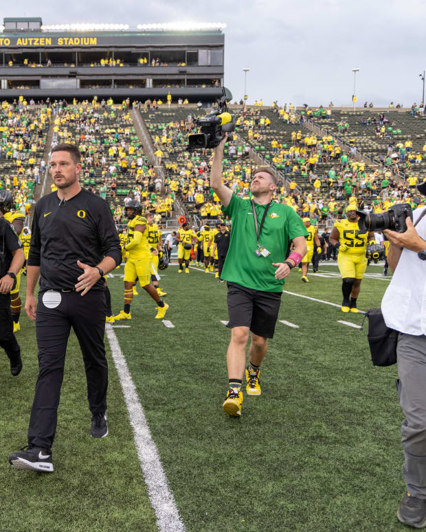 Oregon head coach Dan Lanning on the field.