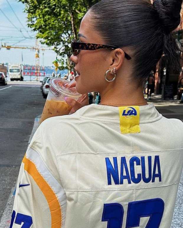 The girlfriend of NFL rookie Puka Nacua walking down the street.