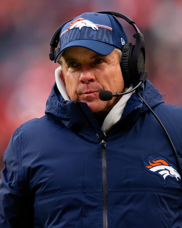 Sean Payton of the Denver Broncos walking on the sideline.