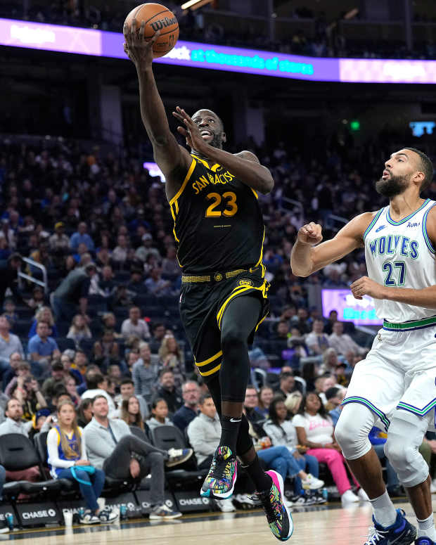 SAN FRANCISCO, CALIFORNIA - NOVEMBER 12: Draymond Green #23 of the Golden State Warriors shoots over Rudy Gobert #27 of the Minnesota Timberwolves during the second half of an NBA basketball game at Chase Center on November 12, 2023 in San Francisco, California. NOTE TO USER: User expressly acknowledges and agrees that, by downloading and or using this photograph, User is consenting to the terms and conditions of the Getty Images License Agreement. (Photo by Thearon W. Henderson/Getty Images)
